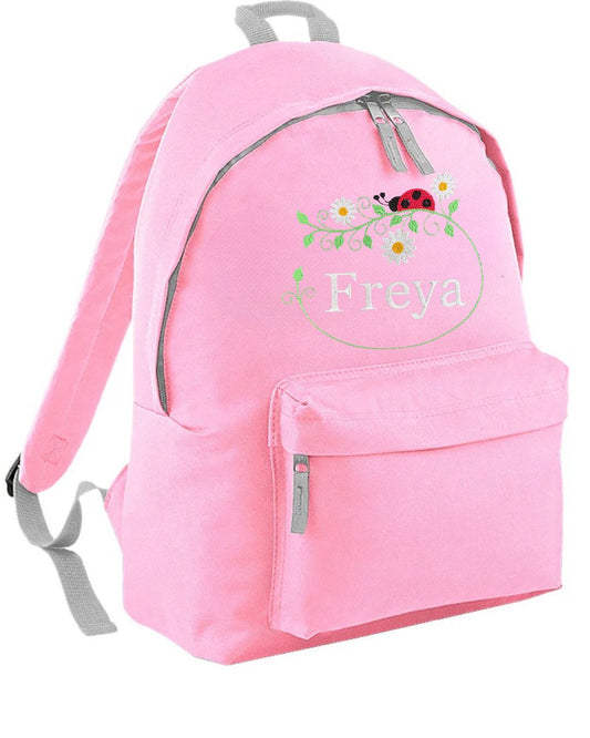 NEW DESIGN! Rucksack personalised with embroidered name and ladybird with flowers. Backpack ideal for Primary, Junior, Infant school bag. Choice of colours